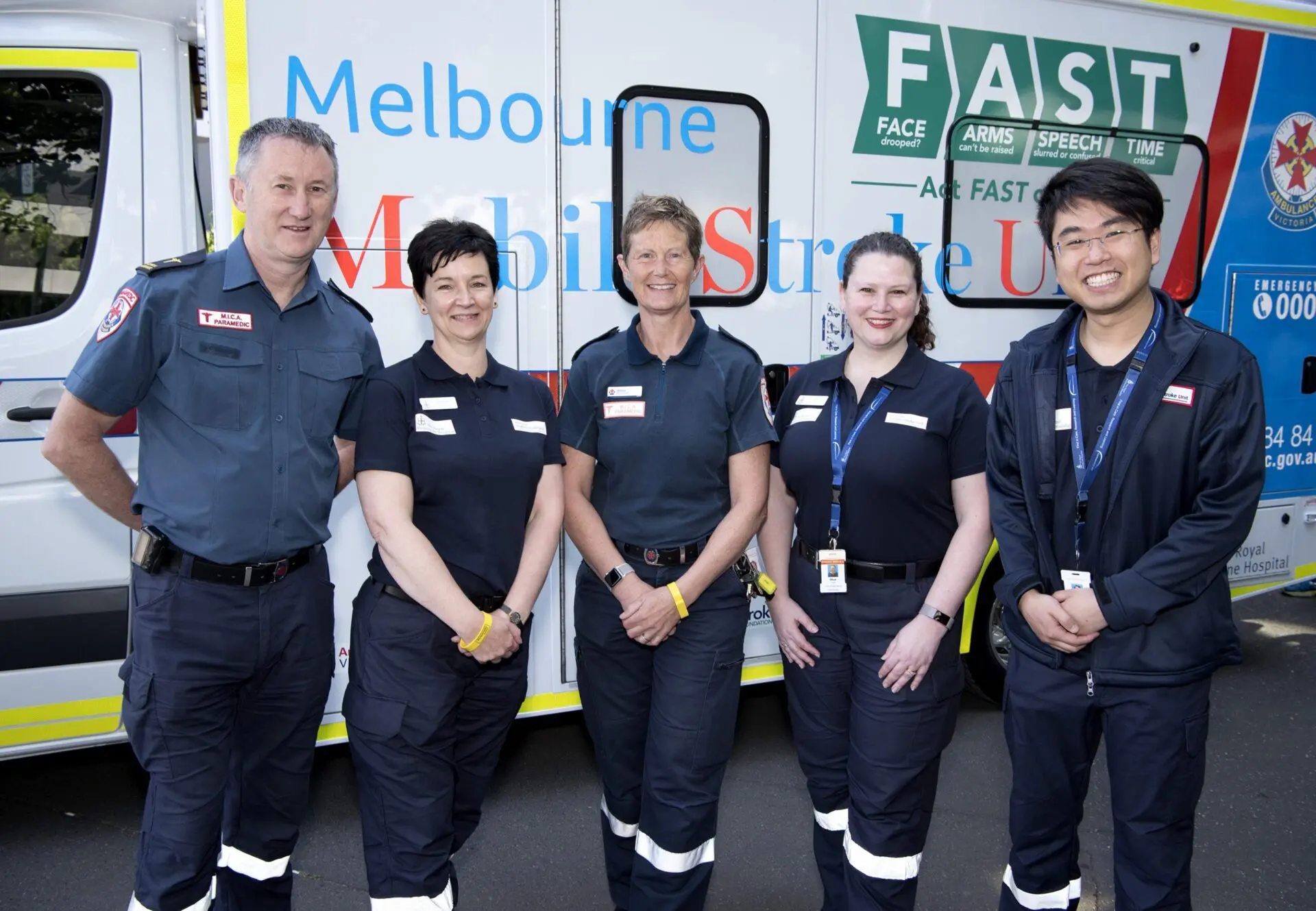 Group of paramedics stood in front of mobile stroke unit.