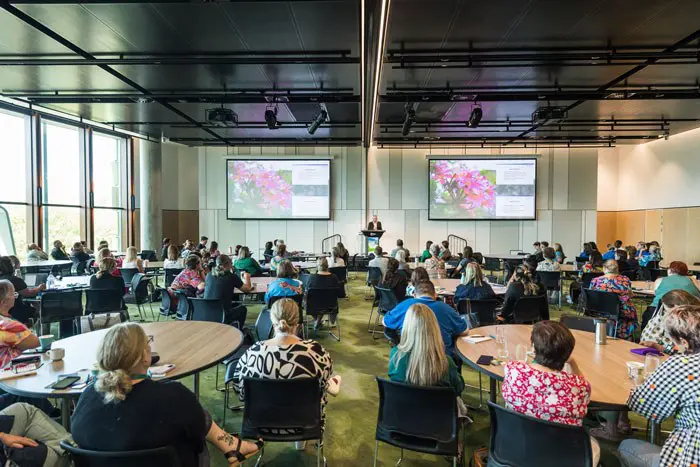Person addressing an audience at conference