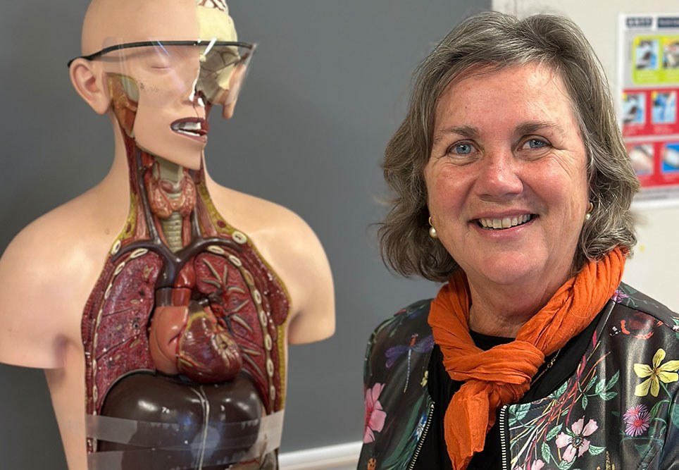 Isabelle Skinner next to a mannequin