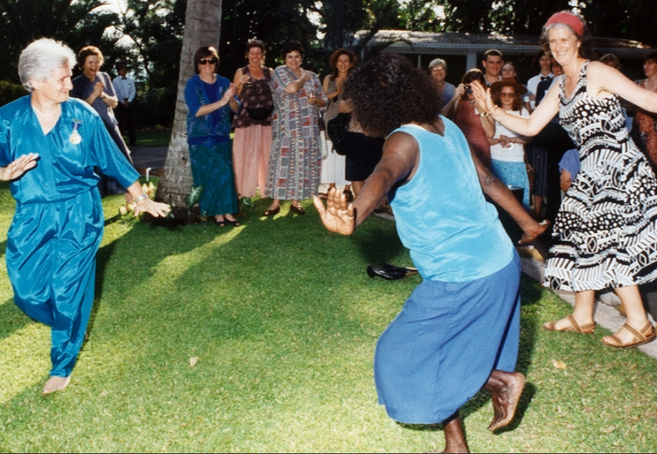Sally Johnson and Vicki Gordon dance with Tiwi Island family at the 1995  Darwin Conference.