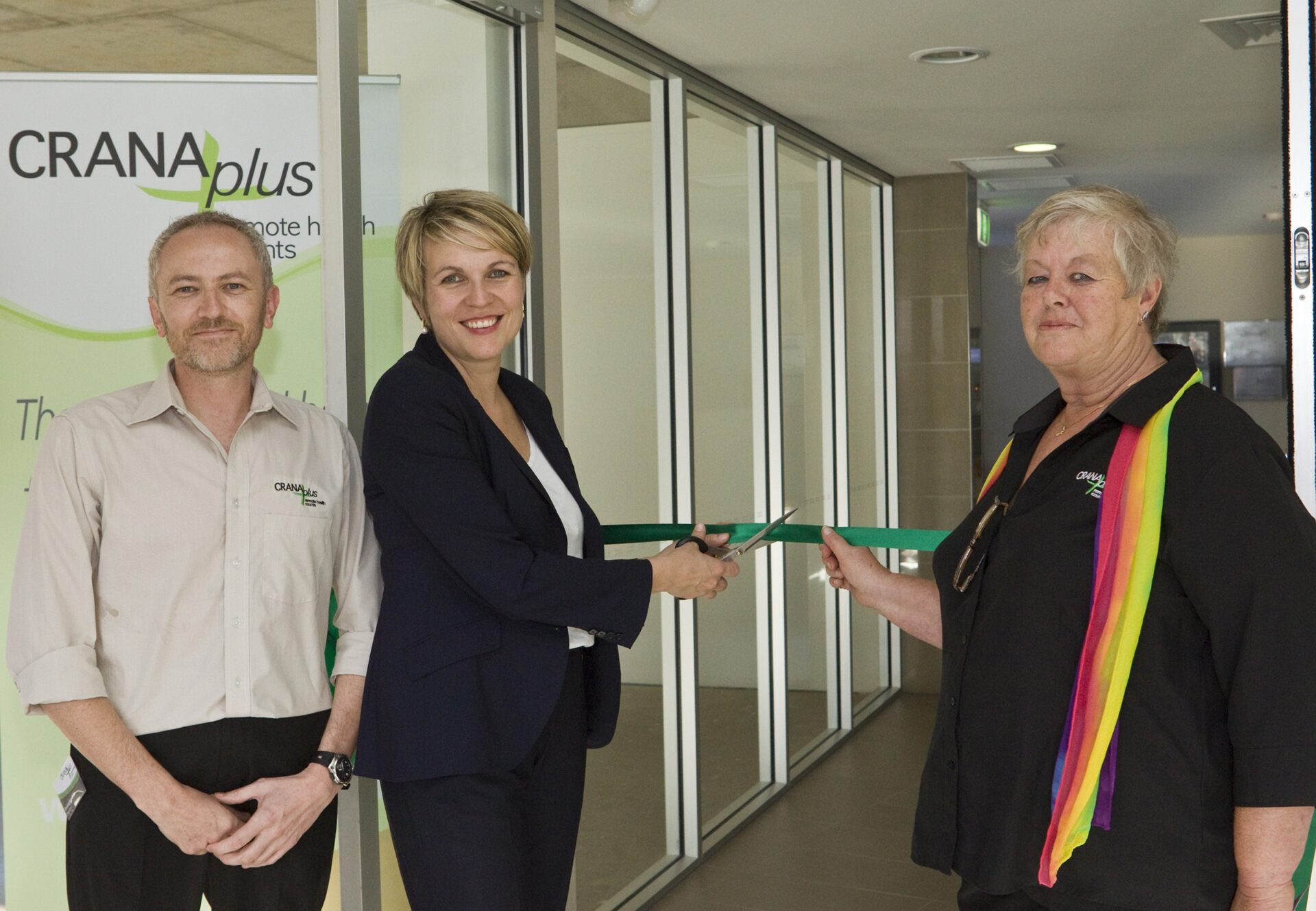 The Hon Tanya Plibersek MP cutting the ribbon at the opening of the CRANAplus Cairns Office, with Christopher Cliffe and Carole Taylor.