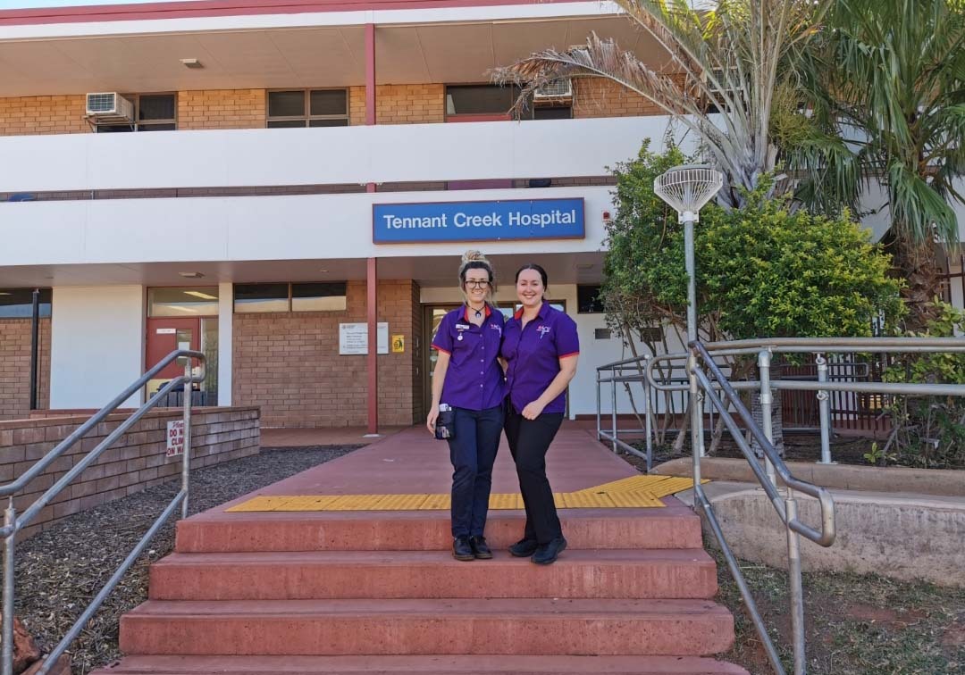 Two women stood on the steps of Tennant Creek Hospital.