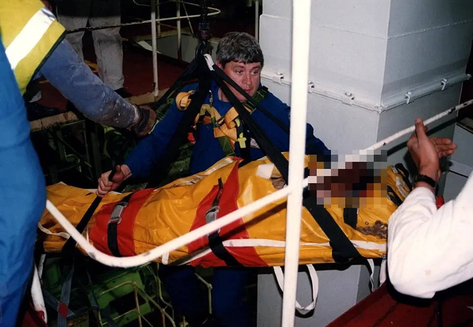 An incident 30 nautical miles off Newcastle. A sailor had fallen down a hatch, we flew to the boat and were winched onto the vessel, the only way to extricate the patient was to stretcher them and use the onboard winch to bring them to a usable deck. The harness lifting point had knocked Ken’s hard hat off during the ascent.