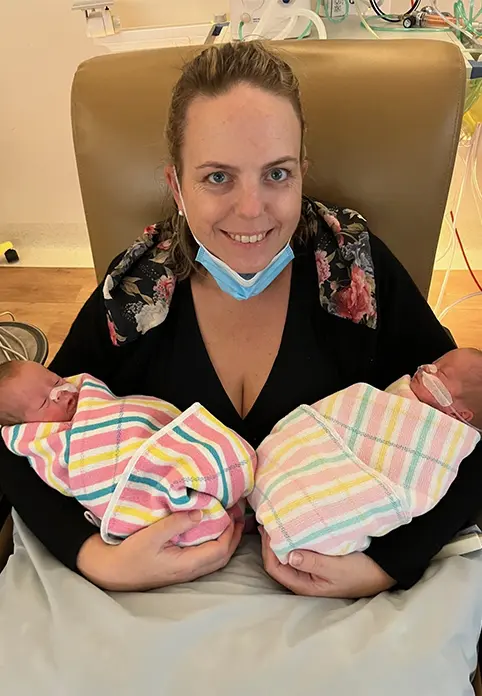 First twin cuddle with Asha and Evie.